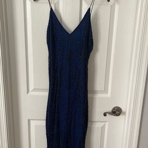 Beautiful formal beaded dress. Navy blue with a split on the front of the dress.